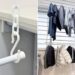 Joint chains holding a secondary rod below a laundry pole with clothes drying on it.
