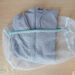 Clothes neatly placed inside a laundry net